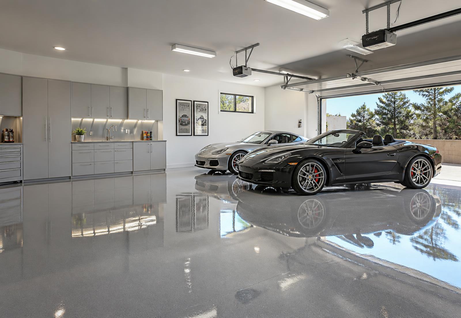 Luxury garage with a high-gloss metallic epoxy floor installed by Colemac Solutions